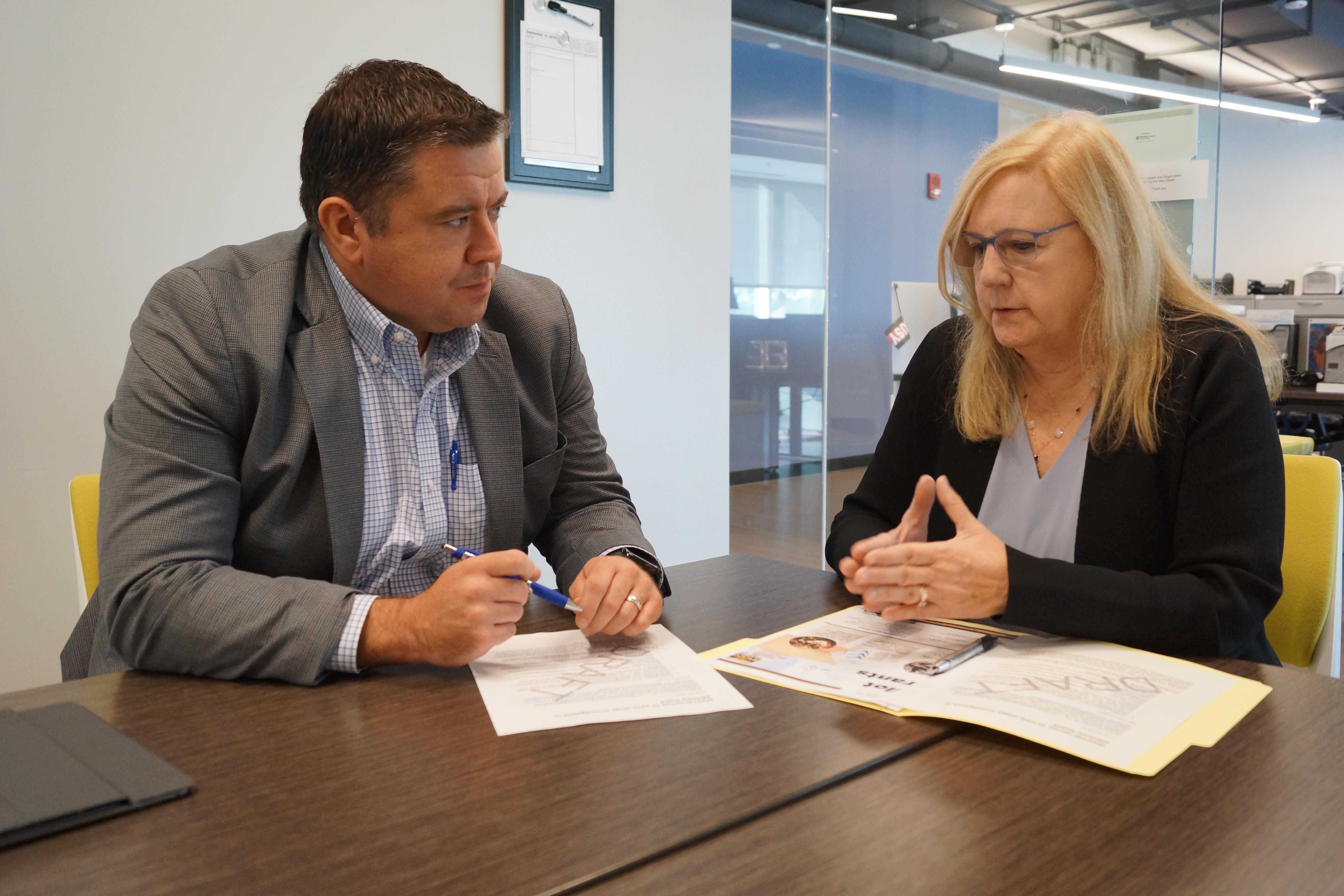 Dr. Joan Lakoski meets with an investigator during a grant writing session