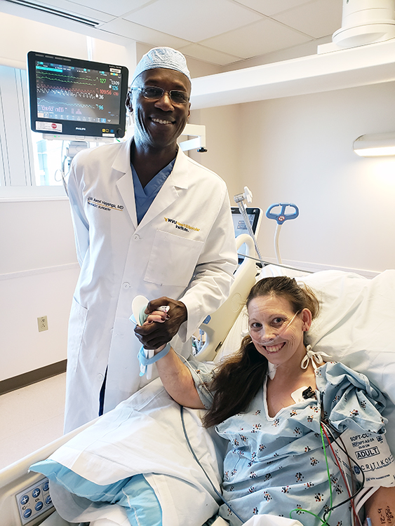 Jeremiah Hayanga, M.D., with patient Misty Dehaven as she recovers from the procedure.