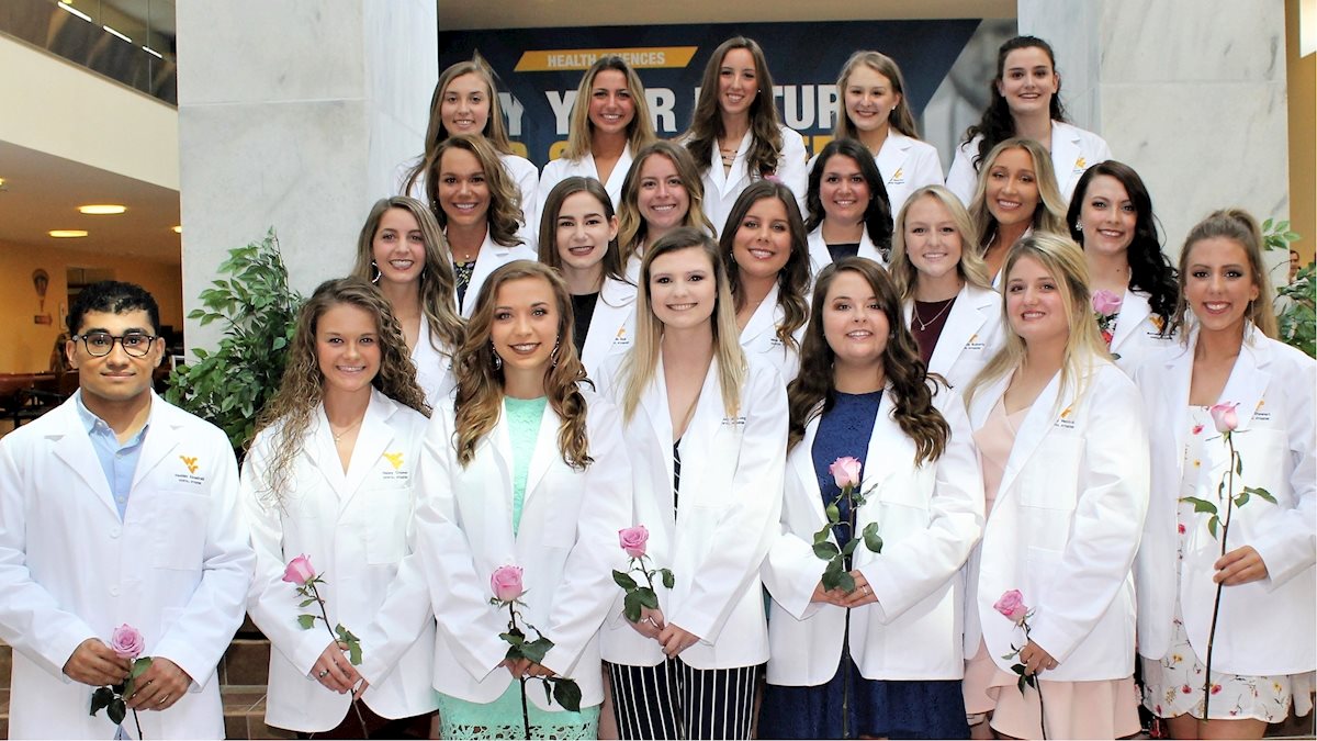 Dental hygiene students presented with white coats