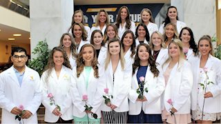Dental hygiene students presented with white coats