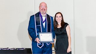 Dental school professor and oral health expert inducted into prestigious national fraternity