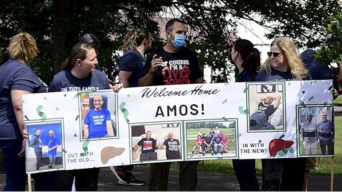 Family and friends welcome home Dr. Amos Lane after liver transplant