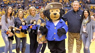 Hugs all around: Friends of WVU Hospitals donates $5,000 to Cancer Research Fund named for coach Bob Huggins' mother 