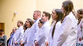 Sophomores formally enter study of nursing during Spring Pledge Ceremony