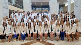 Student-written oath of professionalism recited at WVU dental school clinic induction ceremony