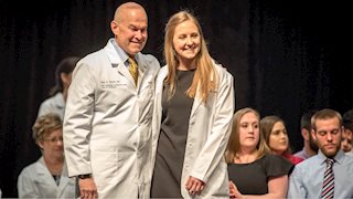 Transitioning from basic science to clinical care, 2nd-year WVU medical students earn white coats