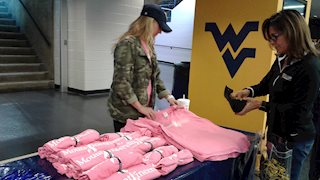 WVU gymnastics team raises breast cancer awareness