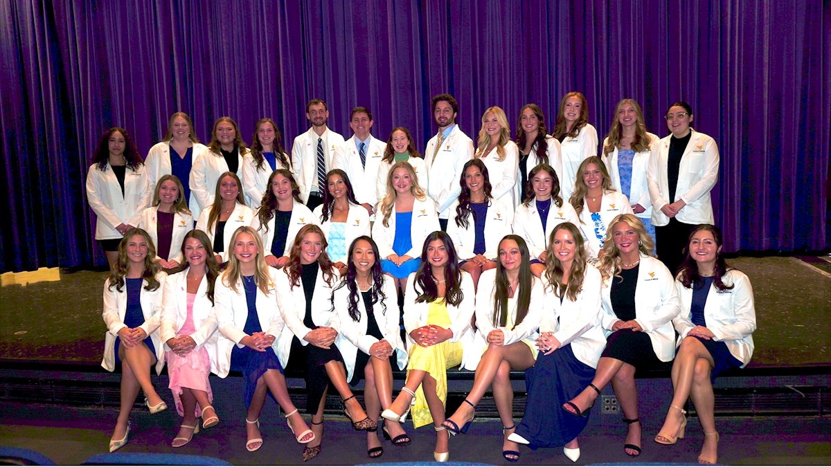 WVU School of Medicine Occupational Therapy students receive white coats, begin clinical rotations