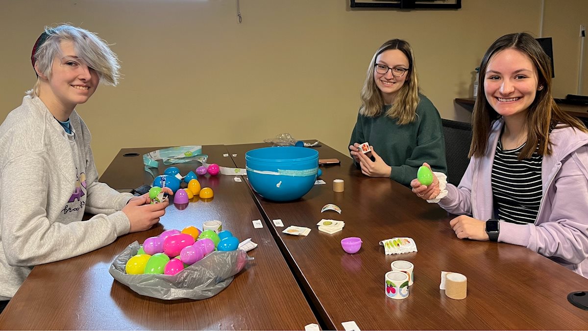 WVU Student Nurses Association and A Moment of Magic fill Easter eggs for  WVU Children's Hospital, School of Medicine